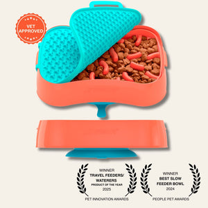 Super Feedy slow feeder with teal lick mat and orange slow feeder, filled with kibble, on a light gray background.